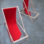 red deckchairs on a concrete floor