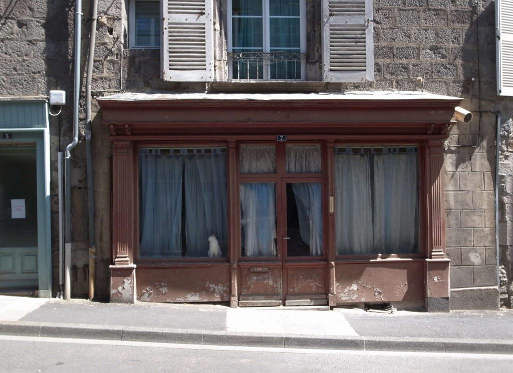 A closed shop in Murat, France. Ande the cat is a real one...