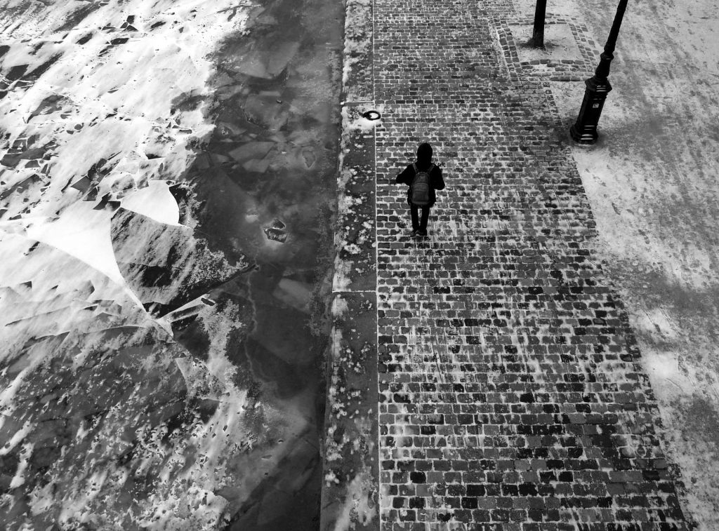 walking man along ice in Paris