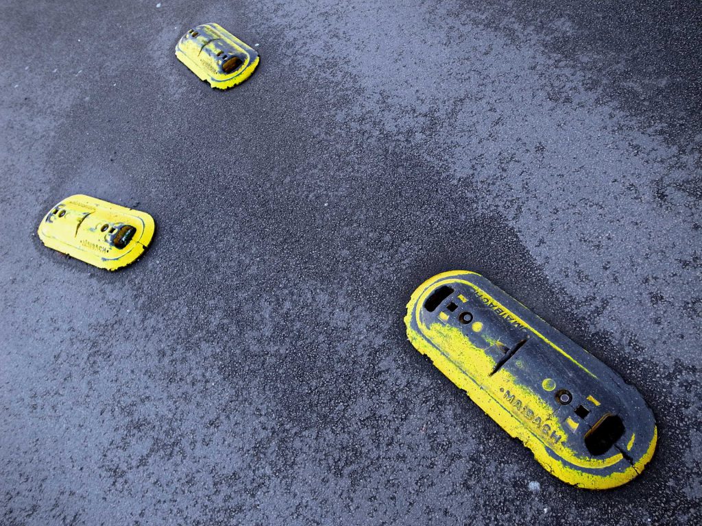 yellow things screwed on the road