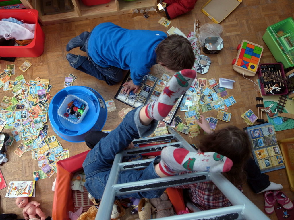 children playing in a messy room